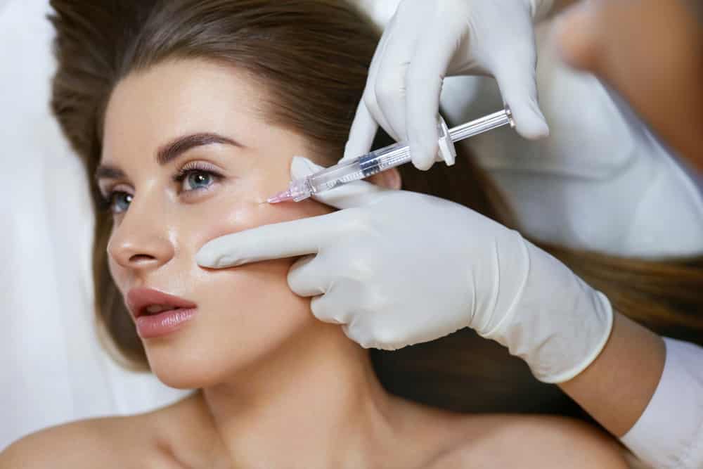Provider performing a precise filler injection