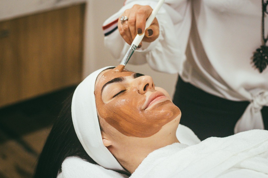Provider applying a professional facial mask treatment